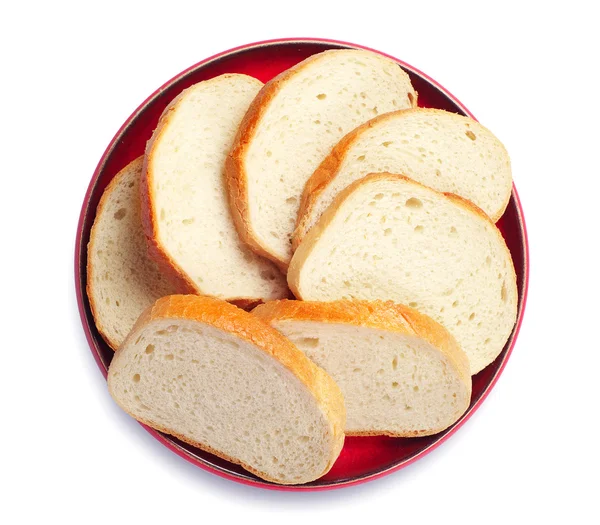 赤いプレートのスライス パン — ストック写真