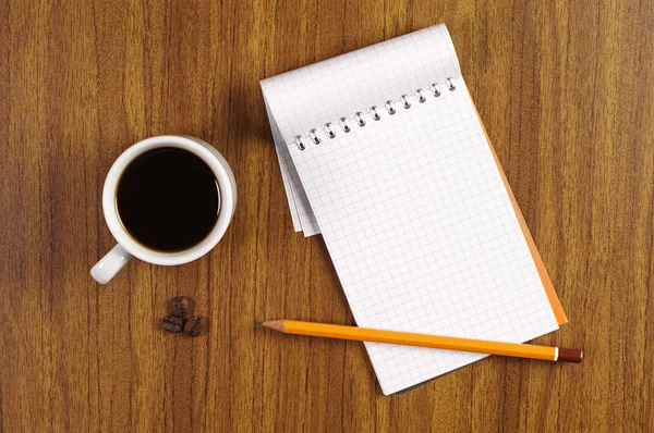 Cup of coffee and notepad Stock Picture