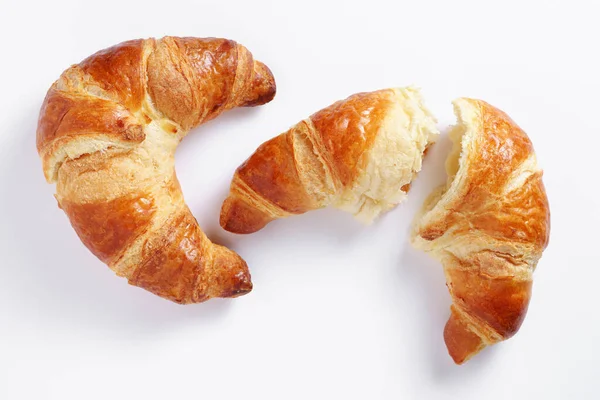 Två Färska Croissanter Vit Bakgrund Ovanifrån — Stockfoto