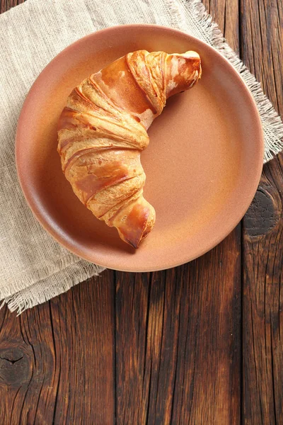 Croissant Brown Plate Wooden Background Top View — Stock Photo, Image