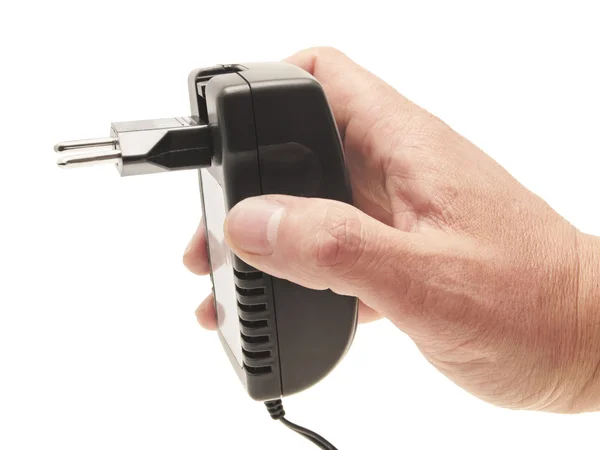 Men's hand with the charger adapter. — Stock Photo, Image