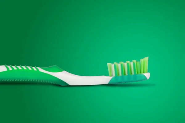 Cepillo de dientes en fondo azul —  Fotos de Stock