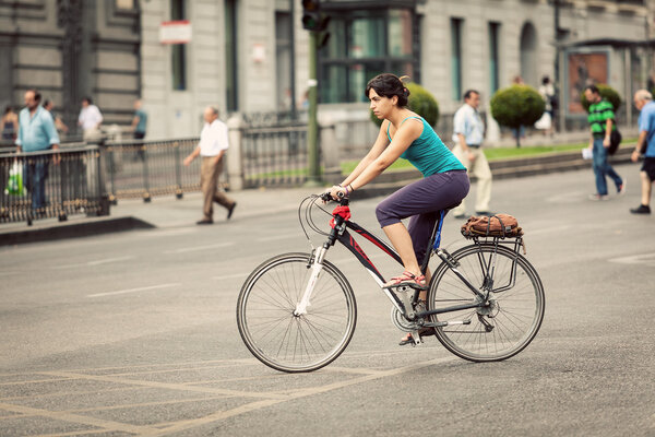 Woman Riding a Bike in Alcala Street, Madrid
