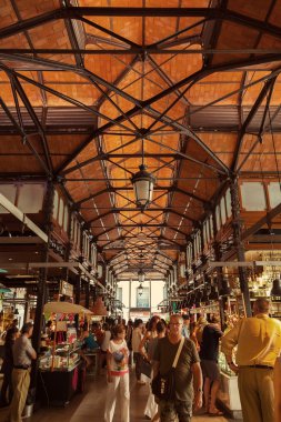 Tourist visiting the famous San Miguel Market in Madrid, Spain