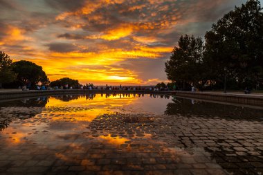 People Admiring the Sunset in Temple of Debod Park, Madrid clipart