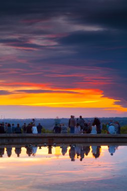 People Admiring the Sunset in Temple of Debod Park clipart