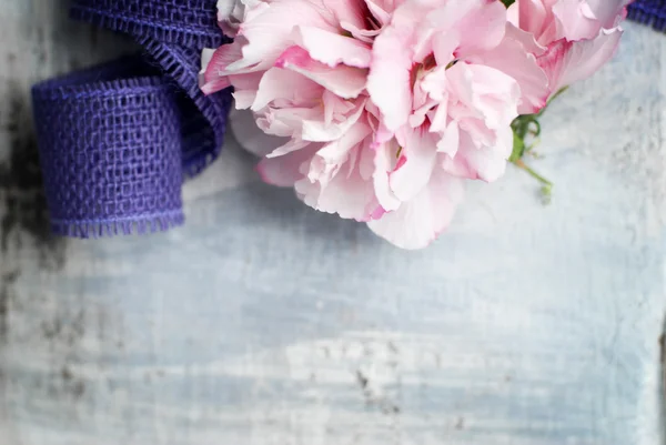 Flowers on wooden background — Stock Photo, Image