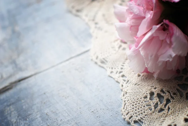 Flowers on wooden background — Stock Photo, Image