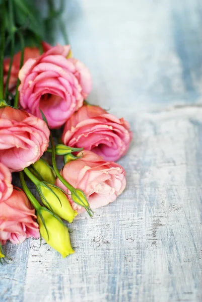 Flowers on wooden background — Stock Photo, Image