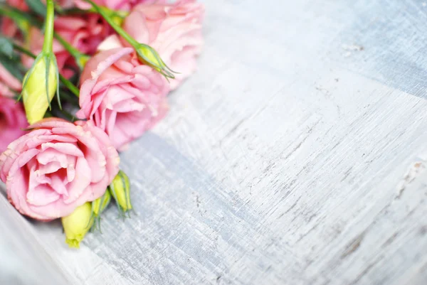 Flowers on wooden background — Stock Photo, Image