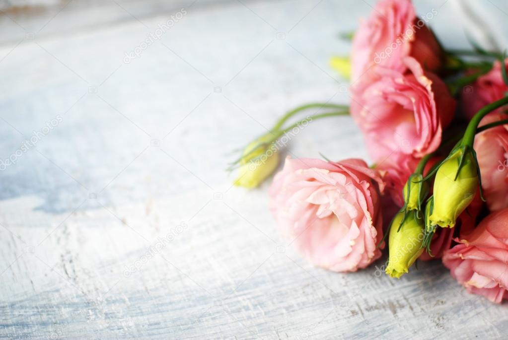 Flowers on wooden background