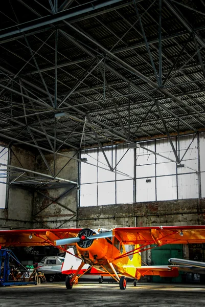 Airplane in hangar — Stock Photo, Image