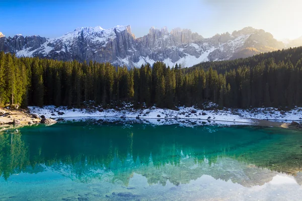 Lago di Carezza (Karersee) with Alps and blue skies, Südtirol, Italy