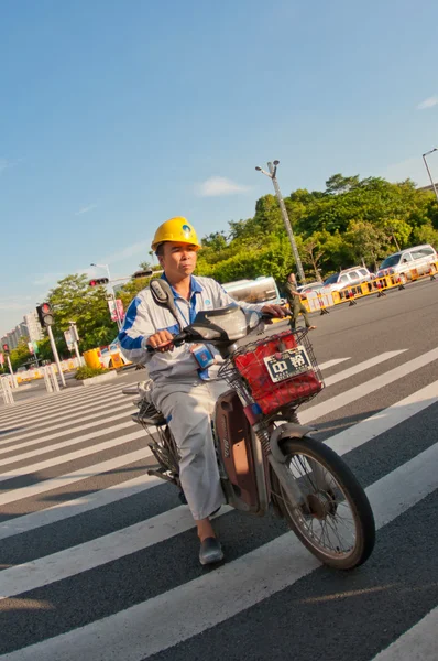 Worker on motocycle — Stock Photo, Image