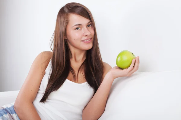 Beautiful young girl with apple — Stock Photo, Image