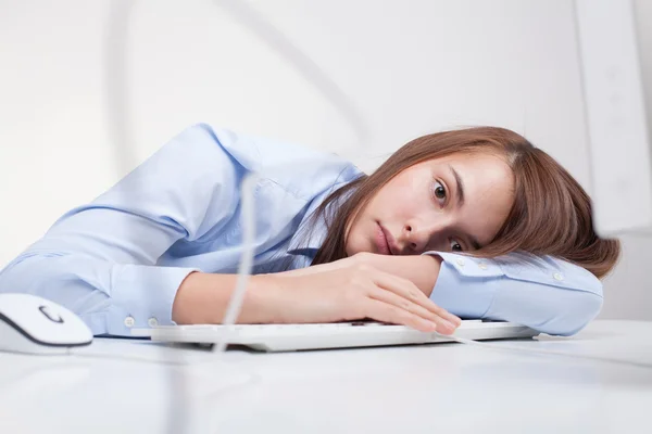 Beautiful woman tired at work — Stock Photo, Image