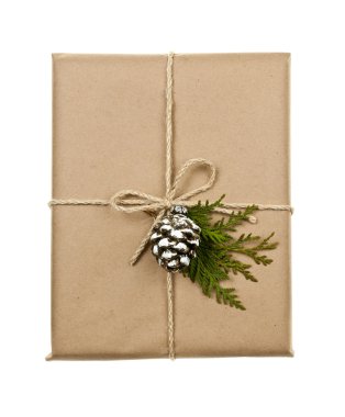 Christmas present in brown paper tied with string clipart