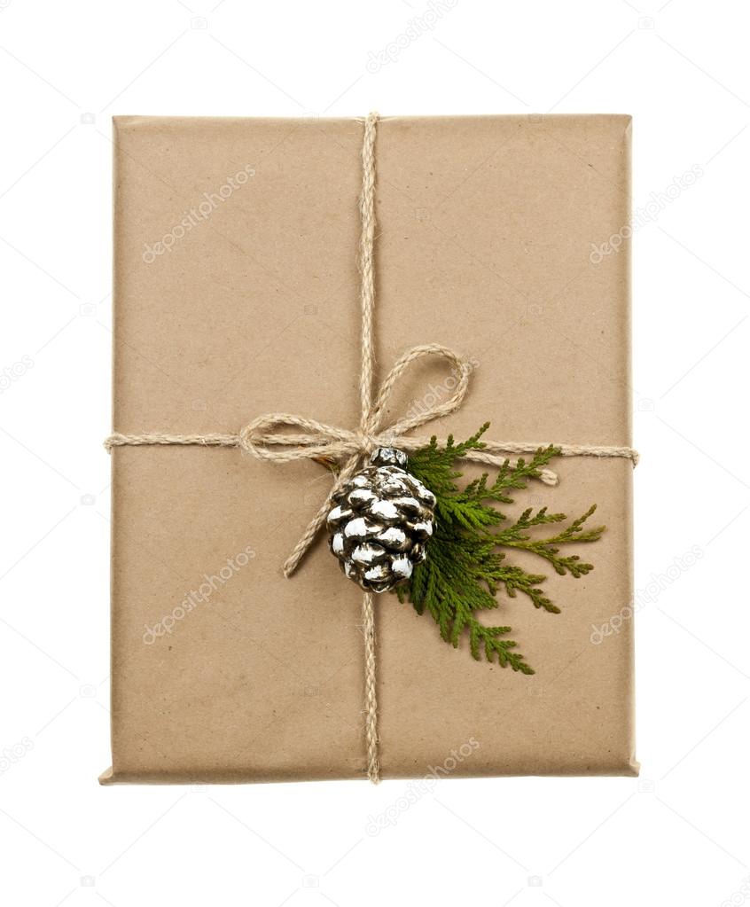 Christmas present in brown paper tied with string