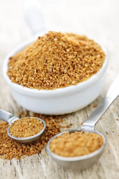 Coconut palm sugar in measuring spoons — Stock Photo, Image