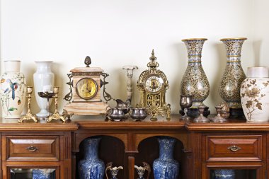 Antique vases and clocks clipart