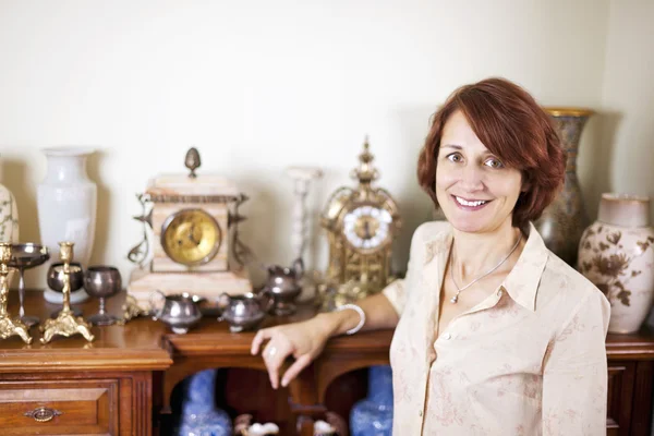 Woman with antique collection — Stock Photo, Image