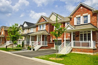 Row of new suburban homes clipart