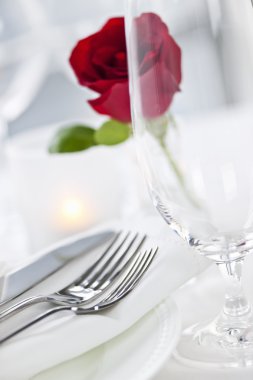 Romantic dinner setting in restaurant clipart