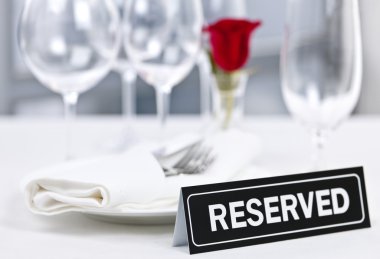 Reserved table at romantic restaurant clipart
