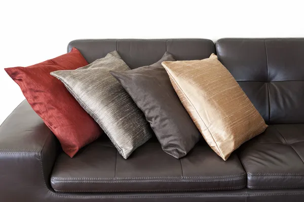 Cushions on leather sofa — Stock Photo, Image