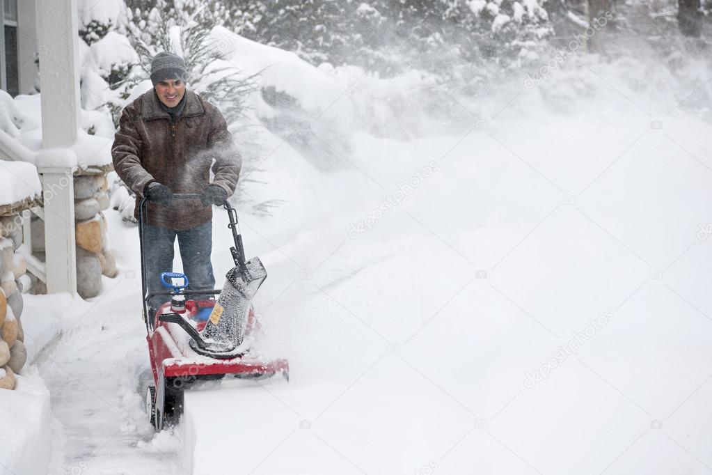 Man using snowblower