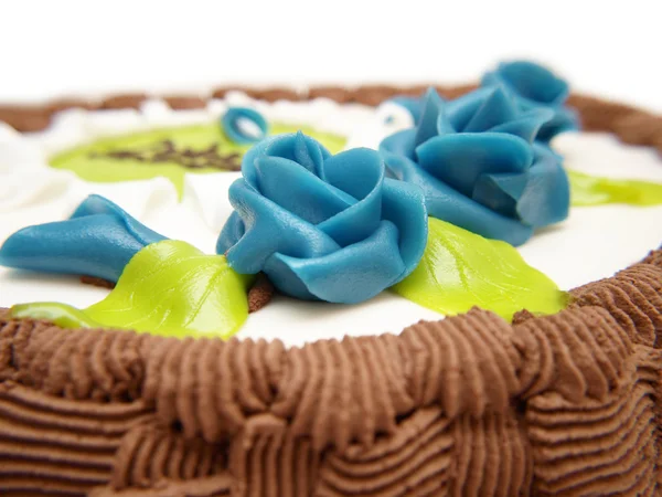 Blaue Rosen auf Kuchen — Stockfoto