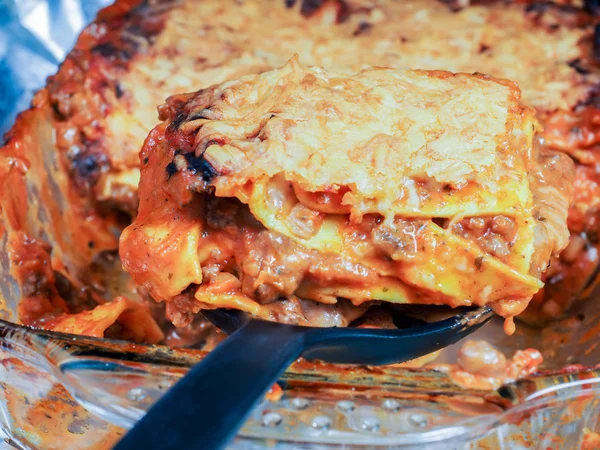 Fresh lasagna on spatula Stock Image