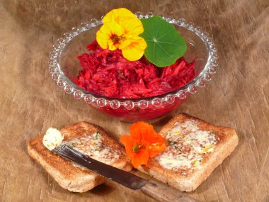 Beetroot salad with herb butter nasturtiums clipart