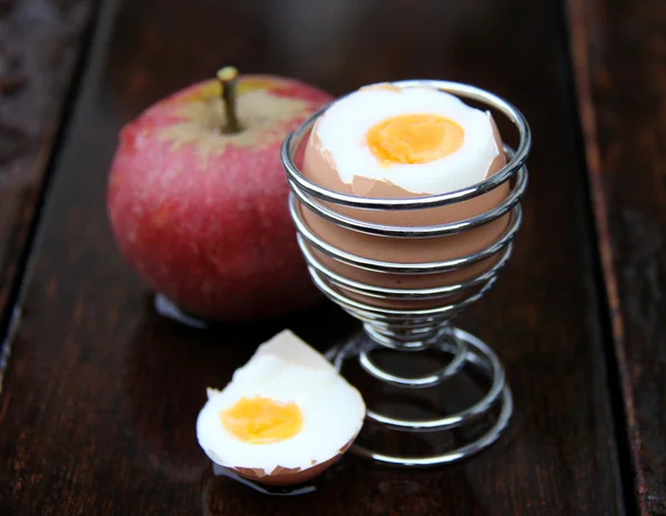 Egg and apple on wood — Stock Photo, Image