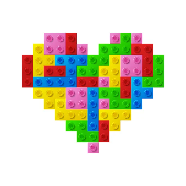 Srdce od plastová hračka bloky. — Stockový vektor