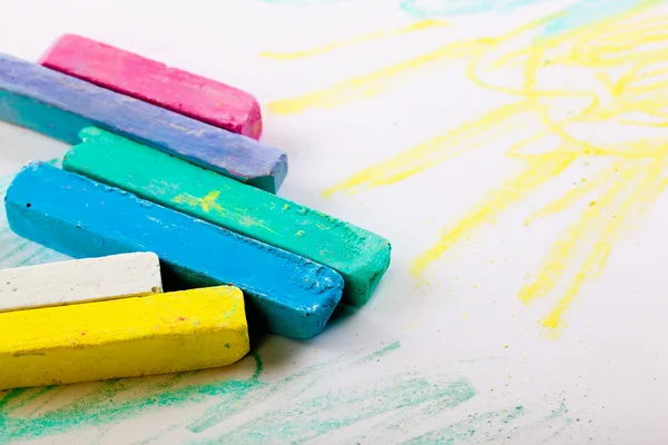Chalks in a variety of colors arranged on a white background — Stock Photo, Image