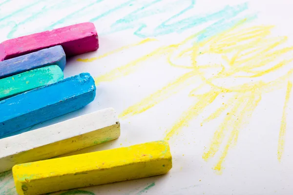 Chalks in a variety of colors arranged on a white background — Stock Photo, Image