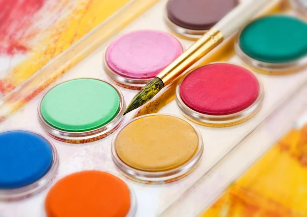 Paints and brushes in the composition — Stock Photo, Image