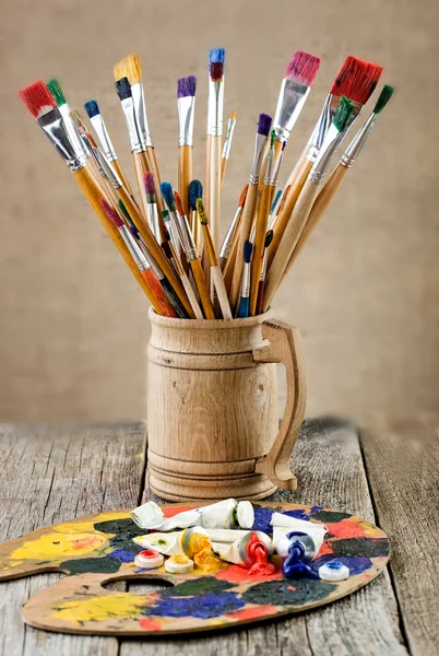 Paints and brushes — Stock Photo, Image