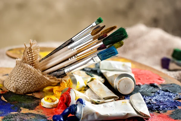 Paints and brushes — Stock Photo, Image