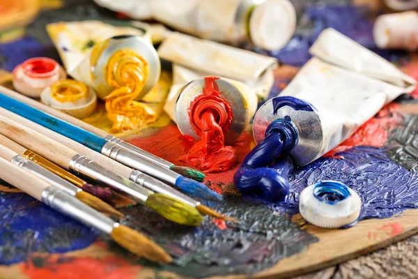 Paints and brushes — Stock Photo, Image