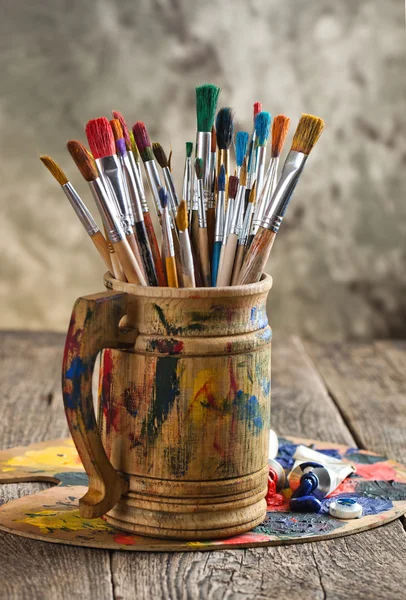 Paints and brushes — Stock Photo, Image