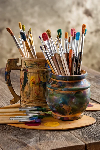 Paints and brushes — Stock Photo, Image