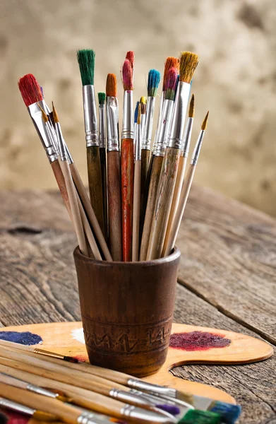 Paints and brushes — Stock Photo, Image