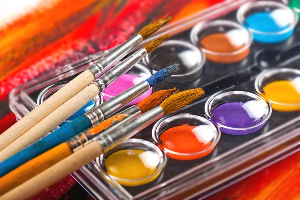 Paints and brushes — Stock Photo, Image