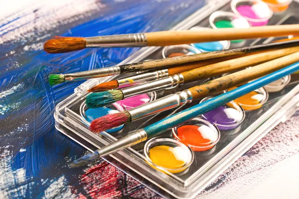 Paints and brushes — Stock Photo, Image