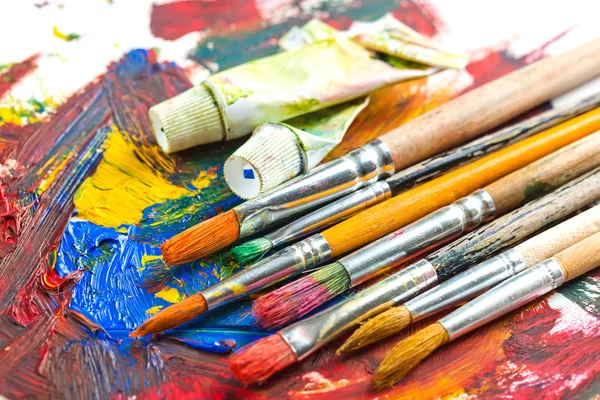 Paints and brushes — Stock Photo, Image