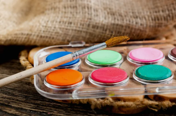 Paints and brushes — Stock Photo, Image