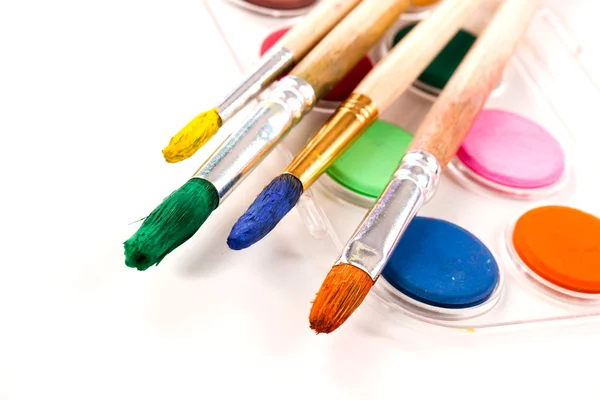 Paints and brushes — Stock Photo, Image