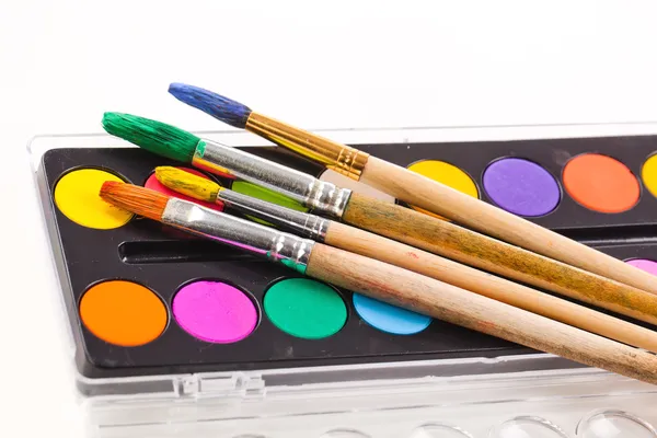 Paints and brushes — Stock Photo, Image